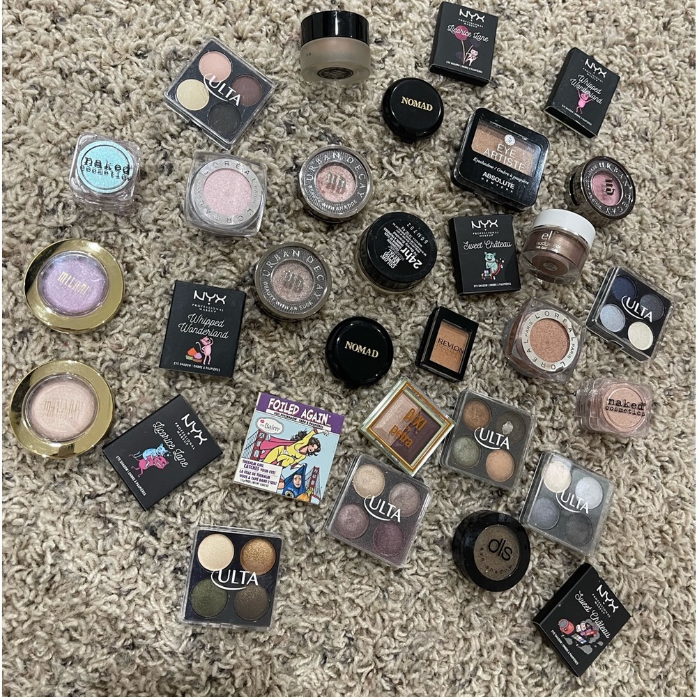 31 mini eyeshadows, some never used, some only swatched and some used